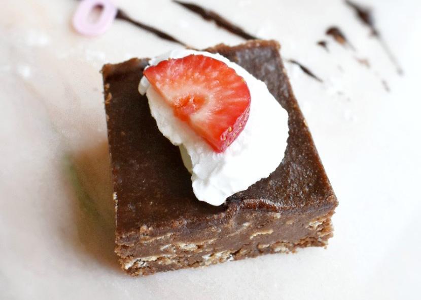 brownie on table with strawberry